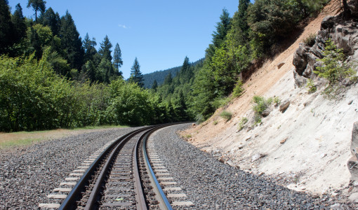 An empty railroad curving into the distance